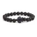 Detailed view of lava stone beads and a turtle charm on this natural stretch bracelet - Lava Stone