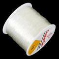 White 0.8mm elastic crystal string cord for DIY jewelry making on black background - 0.8mm Transparent White approx 50m/Roll