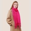 Solid bright rose red cashmere wool scarf with tassel detail worn by woman with coat - Rose Red
