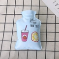 Close-up of a small light blue PVC hot water bottle with cartoon lemon drink pattern - Lemon Drink