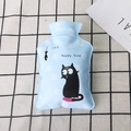 Detail showing high-density PVC light blue hot water bag with cat pattern and white dots - Black Cat