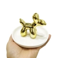 Golden balloon dog sculpture on a white ceramic display tray for jewelry storage - Balloon Dog Jewelry Stand