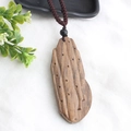 Ethnic style wooden pendant necklace with brown braided rope on a white fabric surface - Style 15