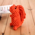 Handwoven squirrel-shaped dog chew toy made of durable orange cotton rope for pet dental care - Squirrel