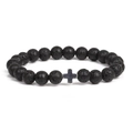 Elastic volcanic rock beaded bracelet with silver cross accent on white background - Silver
