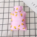 Pink mini PVC hot water bottle with pineapple design and Hello Fruit text on grid background - Pineapple / Pink