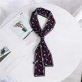 Burgundy and blue leopard print twilly silk scarf tied in a knot on a white stand - Leopard Wine Red Blue