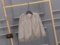 Detailed view of the plush texture and soft taupe faux fur fabric of this warm winter coat - Gray