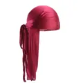 Detailed close-up of wine red silky durag with premium satin texture and long straps - Burgundy