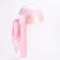 Detailed close-up of pink silky durag featuring long tail straps and premium glossy finish - Pink