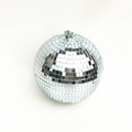 Detailed view of silver reflective disco ball with mirror glass tiles and metal hanging loop - 15cm Silver (Metal Ring)