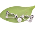 U-shaped silver earring converter with white pearl on green leaves with white background - Screw Earring Clip Bullet Head / Steel