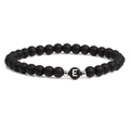 Black matte stone bracelet featuring a silver letter E bead and metallic accents - Letter E