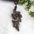 Ethnic vintage necklace with dark brown swirl wood pendant on woven rope - Style 11