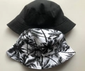 Reversible bucket hat with coconut tree print and plain black cotton for outdoor sun protection - Black