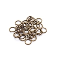 Detailed close-up of antique bronze metal jump rings for DIY jewelry making and crafts - Ancient Green (flat-mouthed Needs To Be Broken Open)