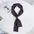 Navy blue leopard print skinny silk scarf accessory on a white fashion magazine backdrop - Leopard Blue Orange