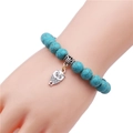 Dettaglio del bracciale con perline di turchese 10mm e ciondolo a civetta in argento - Gufo / Verde petrolio