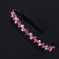 Detail of pink crystal rhinestones on wavy non-slip headband with black base - Rose Red + Pink