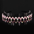 Macro detail of wave headband featuring pink rhinestones and non-slip teeth grip - Pink