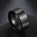 Detailed close-up of a wide black stainless steel ring with a matte finish and polished interior - US 6 / Black