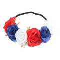 Close-up of artificial red, white and blue roses on a black elastic flower headband - Red Blue White