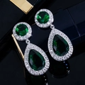Elegant silver earrings featuring deep green pear-shaped zircons with halo accents - Green