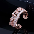 Macro shot of rose gold adjustable ring featuring multilayered square zircon stones - Rose Gold