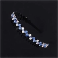 Close-up of wavy non-slip headband with sparkling blue and iridescent rhinestones - Blue