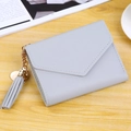 Light grey-blue tassel wallet for women featuring litchi grain faux leather and V-flap - Light Gray
