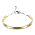 Brazalete en U de acero inoxidable con cadena bicolor de oro y plata y dije de corazón - Dorado