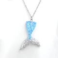 Macro shot of gradient mermaid tail necklace with blue scales and silver glitter detail - Silver/Blue