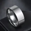 Detailed view of a wide polished stainless steel band ring with silver mirror finish - US 6 / Steel