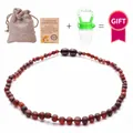 Natural Baltic amber baby necklace in dark red with linen bag and certificate - Matte Blood Amber Style