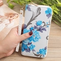 Detail of floral women wallet with blue flower print and detachable wristlet strap - Blue
