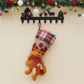 Christmas stocking with 3D plush reindeer, red snowflake embroidery and plaid cuff on wood - Elk