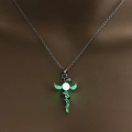 Silver dragon sword necklace with glowing green bead featured on a fashion model - Antique Silver + Yellow Green (Dragon Sword)