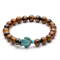 Tiger eye beaded bracelet featuring a turquoise colored sea turtle charm on white background - Tiger Eye Sea Turtle Style (D Style)