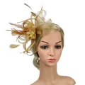 Close-up of elegant gold feather fascinator with lace mesh and pearl accents - Gold