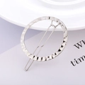 Macro detail of silver round hair clip featuring hand-hammered texture on metal surface - Silver - Hammered Round
