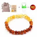Baltic amber baby bracelet with gradient beads, linen pouch, and certificate set - Frosted Rainbow