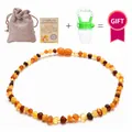 Natural Baltic amber baby necklace with linen bag, certificate, and fruit feeder - Matte Multicolor Style