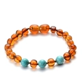 Baltic amber baby bracelet featuring translucent beads and turquoise accents on brown cord - Turquoise Amber