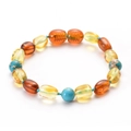 Braccialetto bimbo stile ambra con perle turchesi e ciondoli rotondi in resina colorata - Stile Ambra Multicolore e Turchese