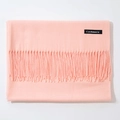 Thick peach pink cashmere shawl with fringe trim, folded horizontally on a white surface - Snow Bud