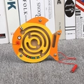 Fish-shaped wooden magnetic bead maze puzzle for toddlers on a gray carpet background - Fish
