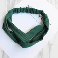 Elastic forest green ribbed knit twisted headband for women with cross knot design - Knitted Dark Green