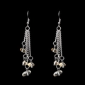 Macro detail of long layered silver chain tassel earrings with natural yellow stone beads - Citrine