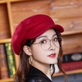 Classic red wool newsboy cap for women shown in a stylish retro autumn profile view - One Size / Burgundy