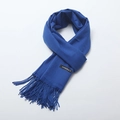 Royal blue cashmere scarf with brushed twill texture and fringed edges in a flat lay view - Sapphire Blue